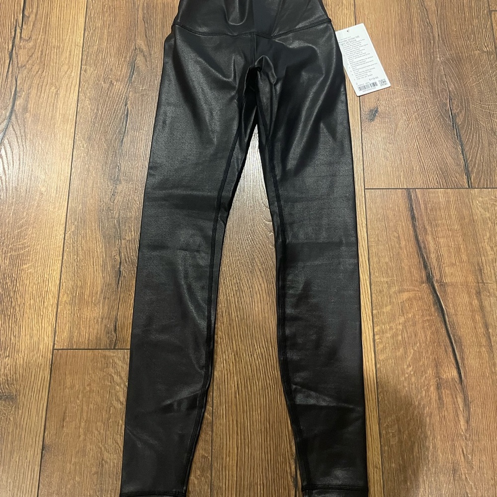NWT lululemon black womens Wunder under HR tight 28” shine leggings.